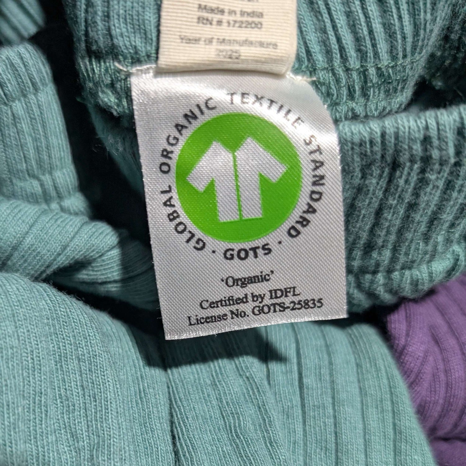 GOTS organic textile standard label on a knitted fabric background