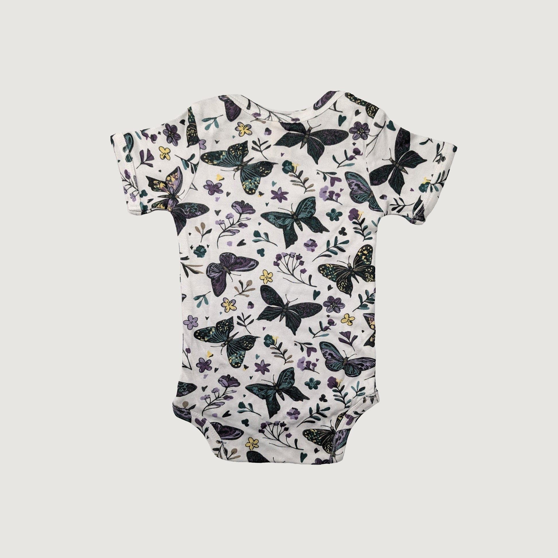 Lap neck baby onesie with butterfly and floral pattern on a white background