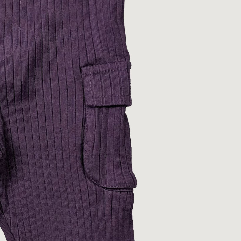 Close-up of a ribbed purple sweater with two front pockets organic cotton