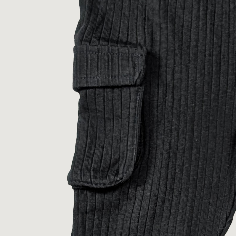 Close-up of black ribbed knit pants with cargo pockets organic cotton