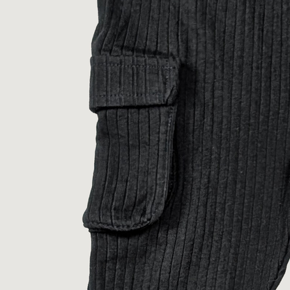 Close-up of black ribbed knit pants with cargo pockets organic cotton