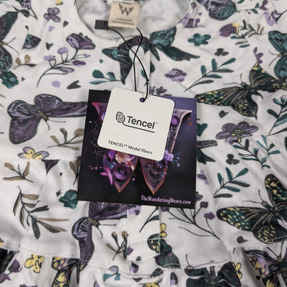 Fabric with butterfly pattern and Tencel label on a plain background